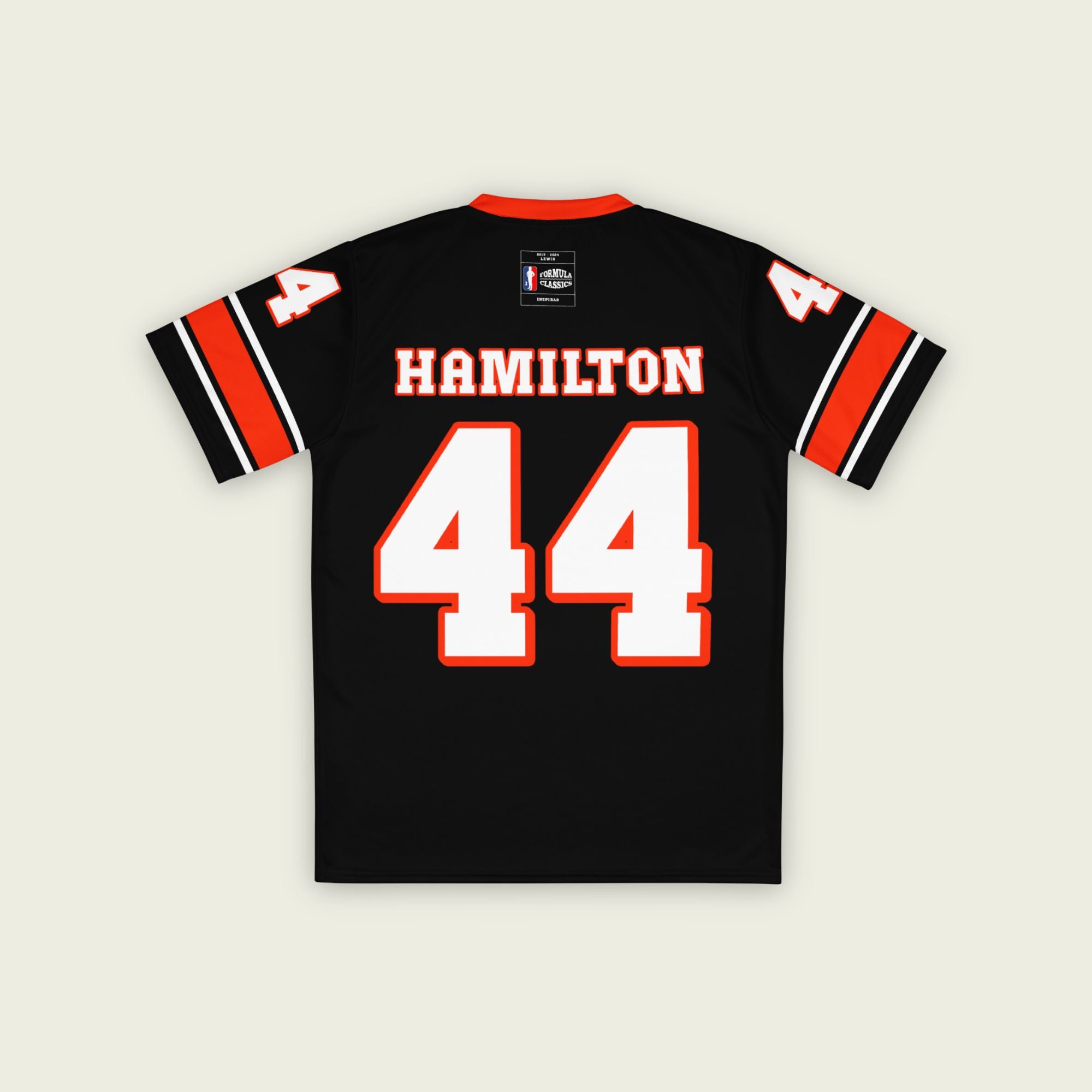 A black and red football jersey with Lewis Hamilton's Ferrari  F1 racing number 44 on the back and front in white. It has the name Hamilton in red on the front and back as well.