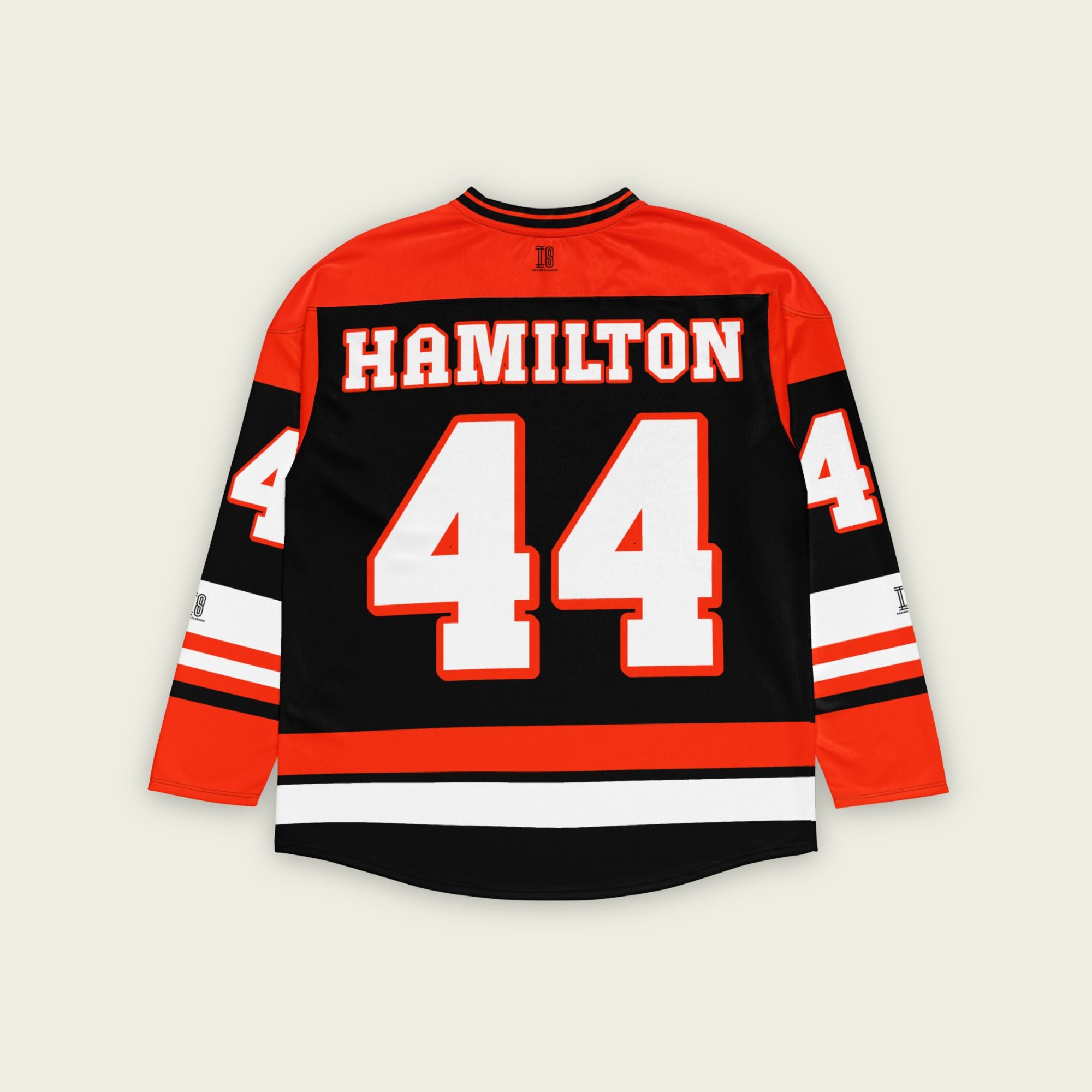 A red and black hockey jersey with Lewis Hamilton's F1 racing number 44 in white on the front and back. It has the name Hamilton on the back and front in white as well.