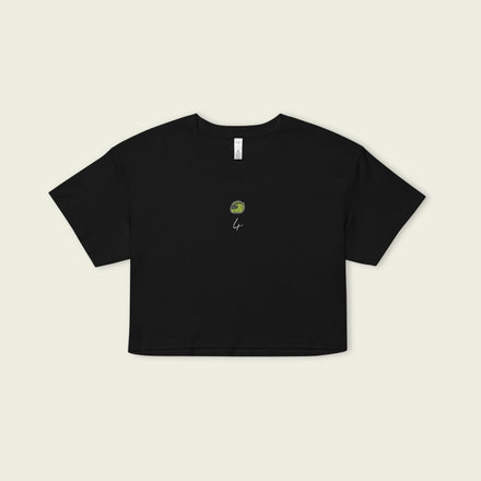 A black crop top with a carton image of Lando Norris's neon green and black helmut, with the number 4 in white below it.