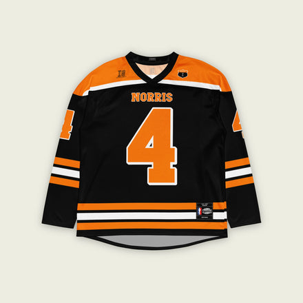 A black hockey jersey with lando norris's mclaren F1 racing number 4 on the front and the black. it has oragne stripesin the top, bottom, and arms. WIth his last name norris on the front and back.