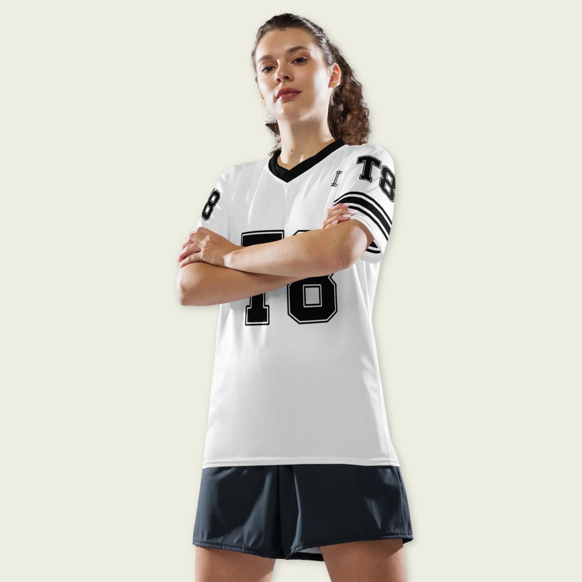 A black and white football jersey with Tate Mcare on the back and front in white with a white  outline.