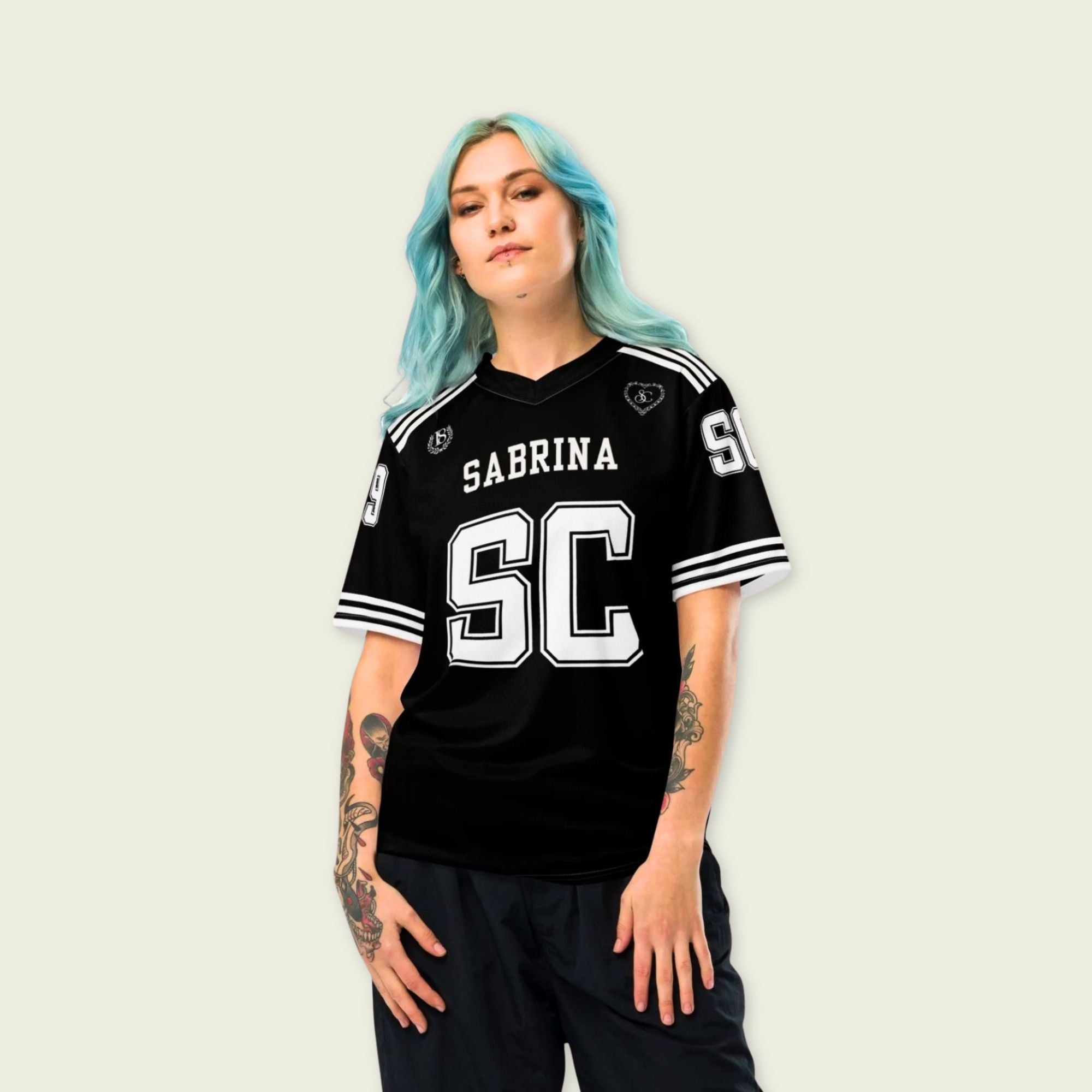 Person wearing a black sports jersey with 'Sabrina SC' on a plain background