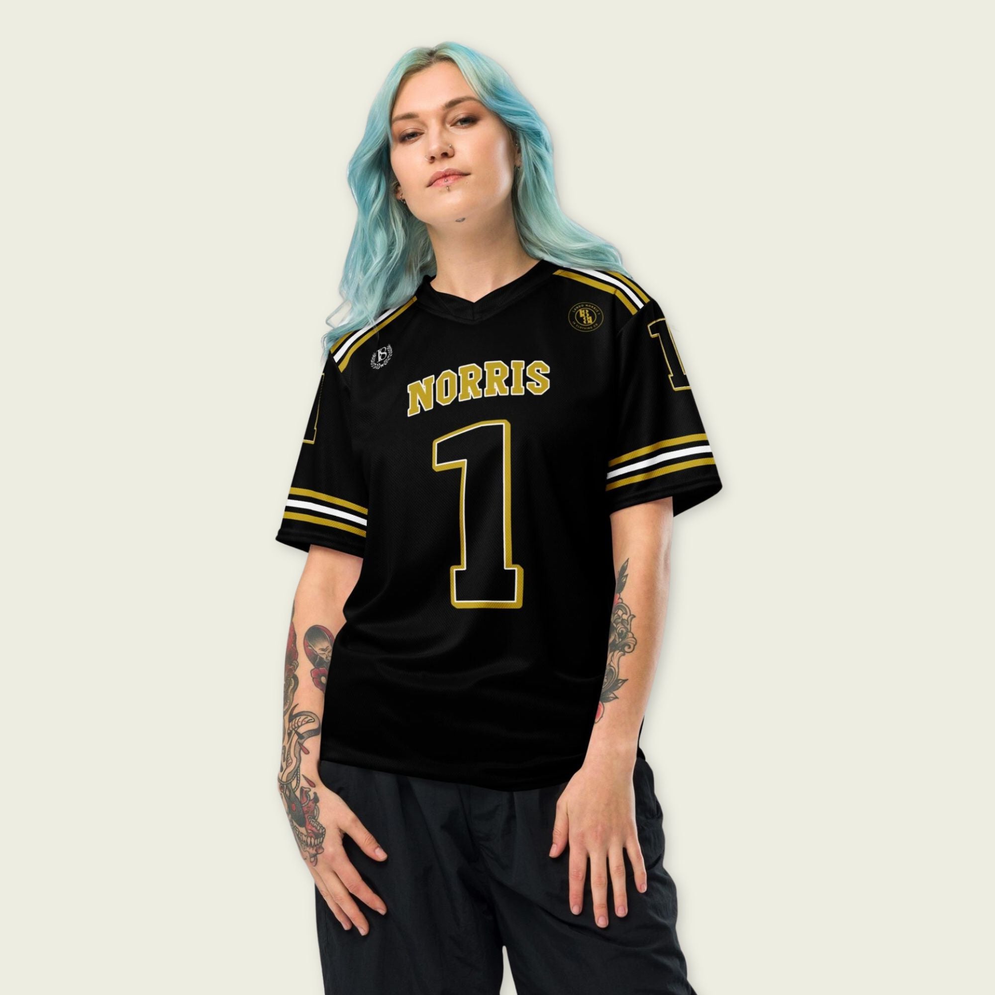 Person wearing a black sports jersey with 'Norris' and number '1' on a plain background