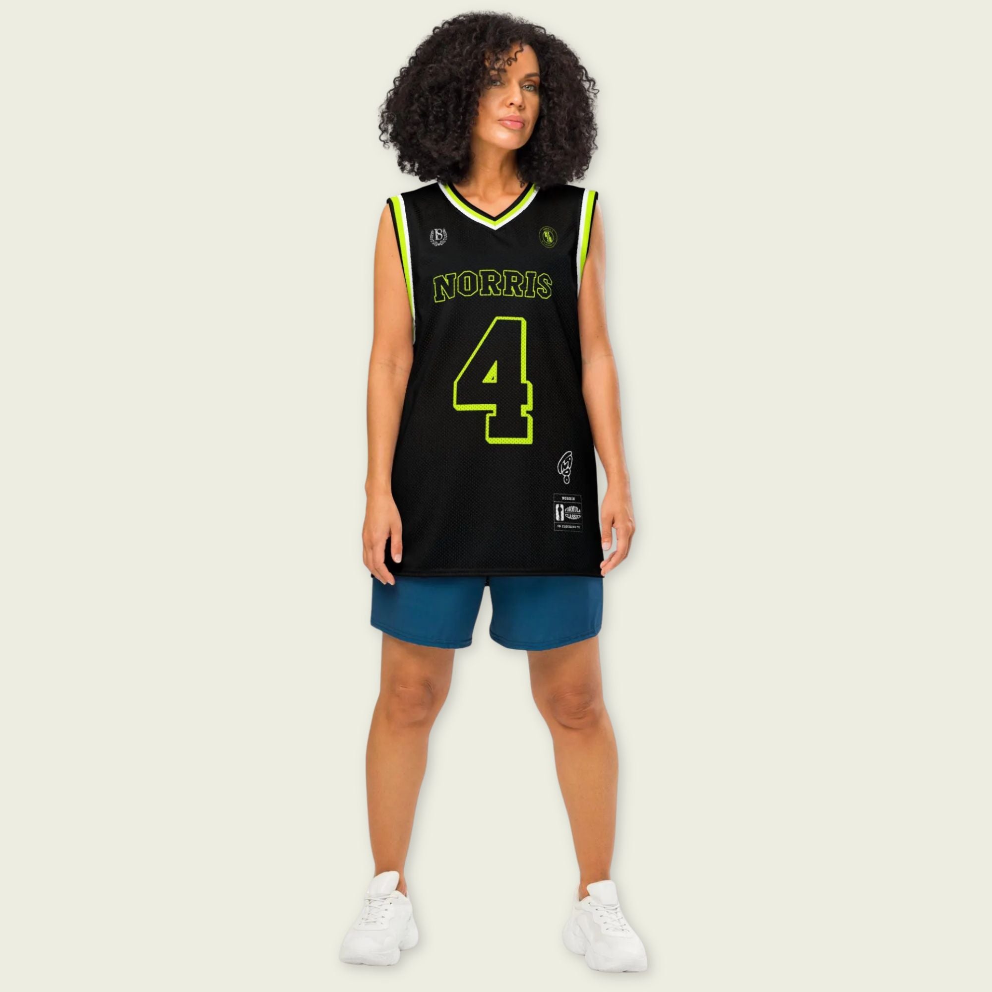 Person wearing a black basketball jersey with 'Norris' and number '4' on a beige background
