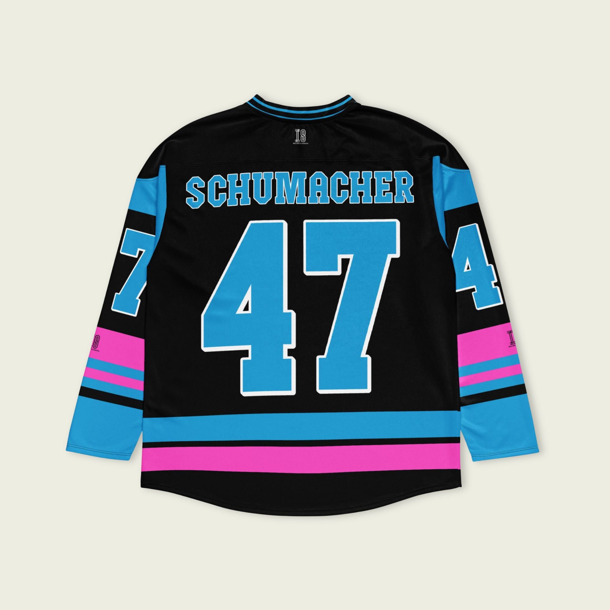 A black, pink and blue hockey jersey with Mick Schumacher's Alpine racing number 47 on the front and back in blue, also the name Schumacher is on the back and front in blue.