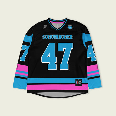 A black, pink and blue hockey jersey with Mick Schumacher's Alpine racing number 47 on the front and back in blue, also the name Schumacher is on the back and front in blue.