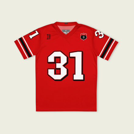 A red football jersey with Ocon's Haas F1 Racing number 31 in white on the front and back.