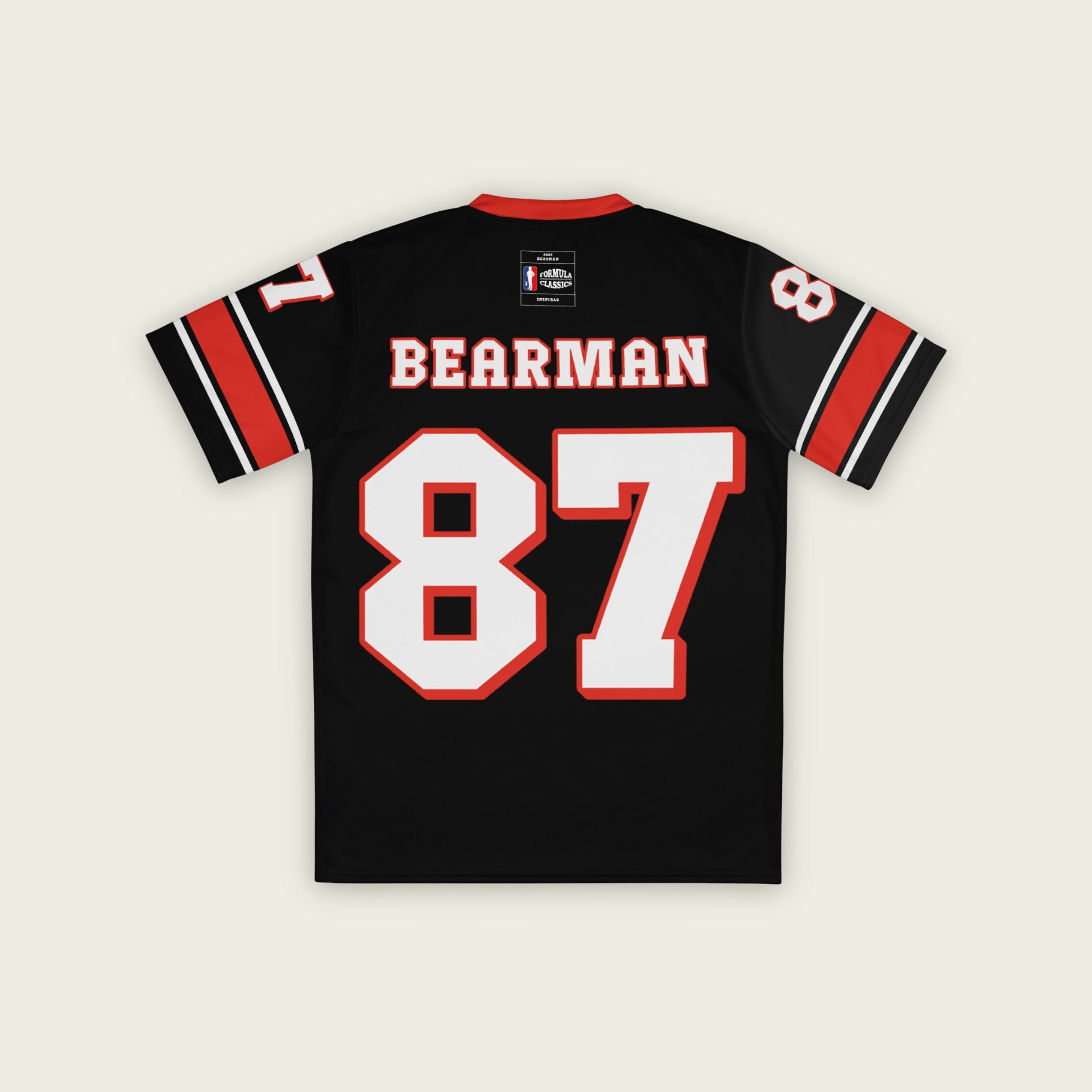 A black and red football jersey with Oliver Bearman's Haas F1 Racing number 87 in white on the front and back.