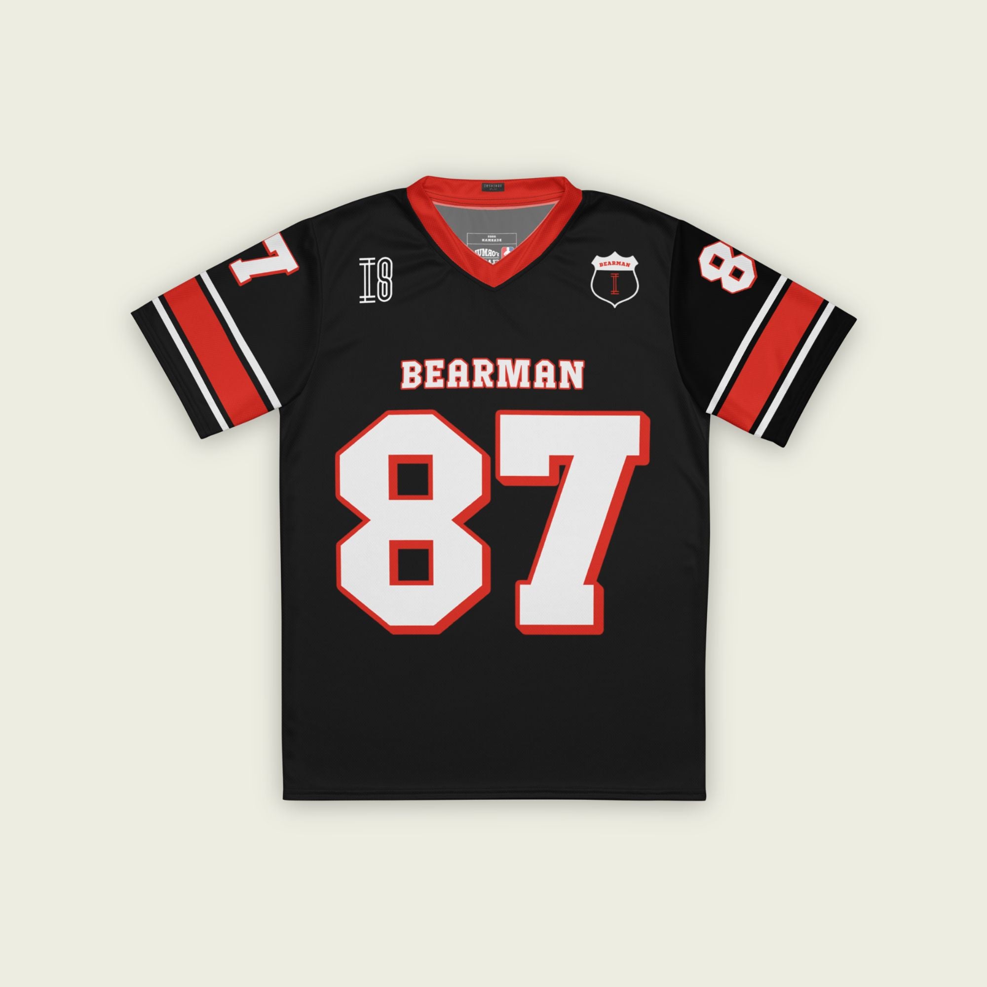 A black and red football jersey with Oliver Bearman's Haas F1 Racing number 87 in white on the front and back.