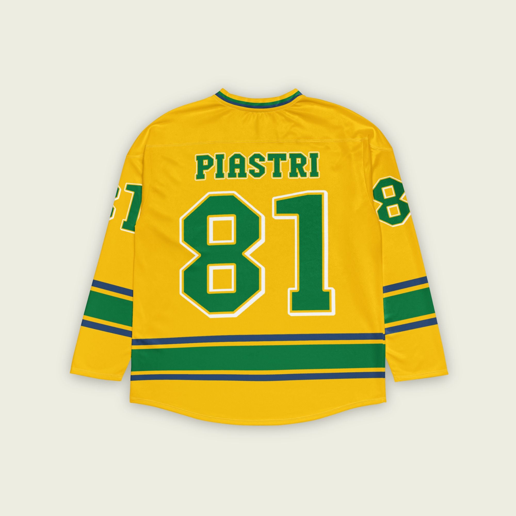 A yellow hockey jersey with green and navy blue stripes. It has Oscar Piastri's McLaren F1 racing number 81 and his name on the front and back in Green with a white and blue outline.