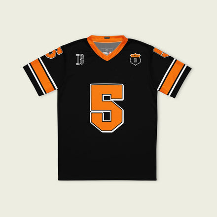 A black and orange football jersey with Pato O'Ward Arrow McLaren Indycar racing number 7 in orange.