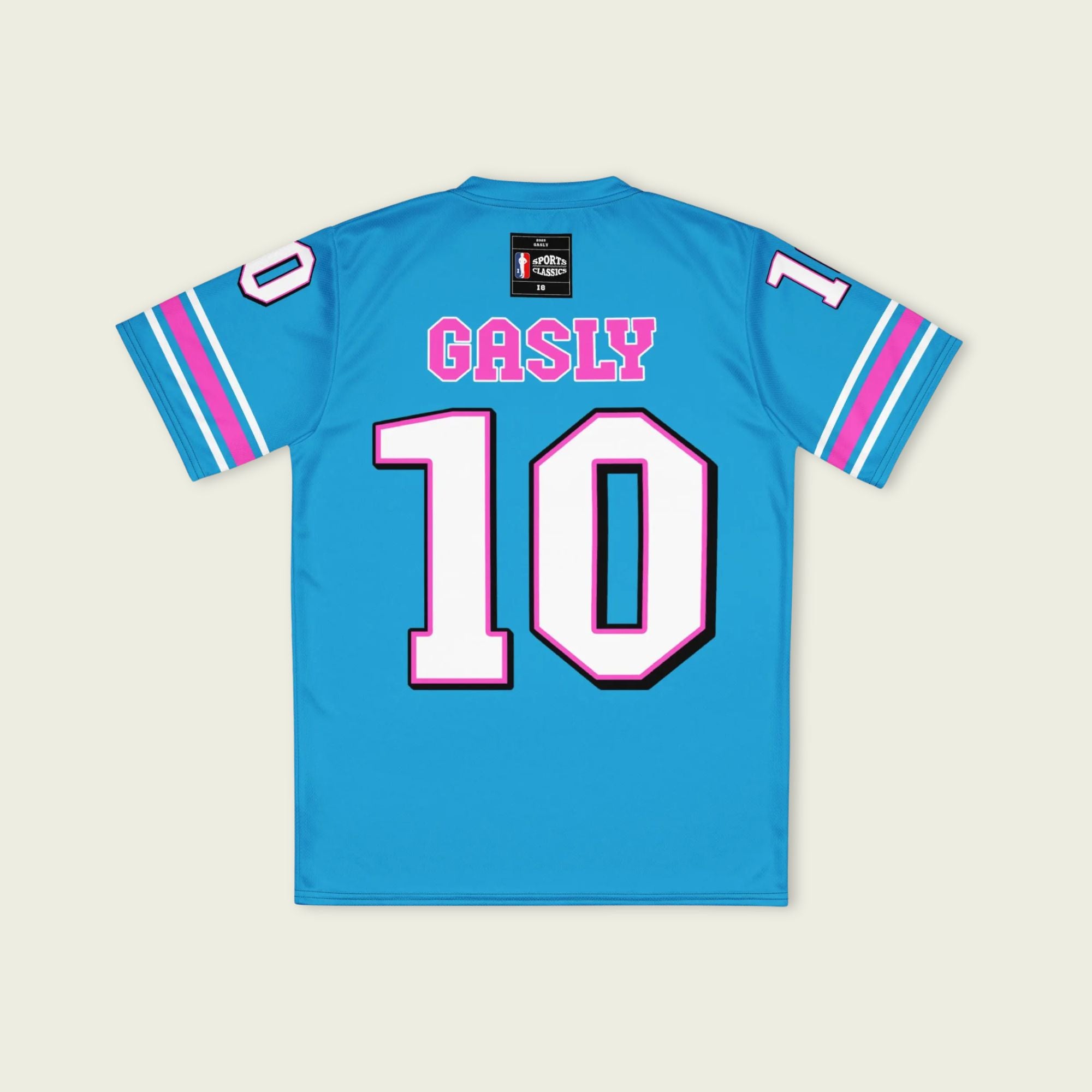 A blue and pink football jersey with Pierre Gasly' s Alpine F1 Racing number 10 on the front and back in white with a pink and black outline.