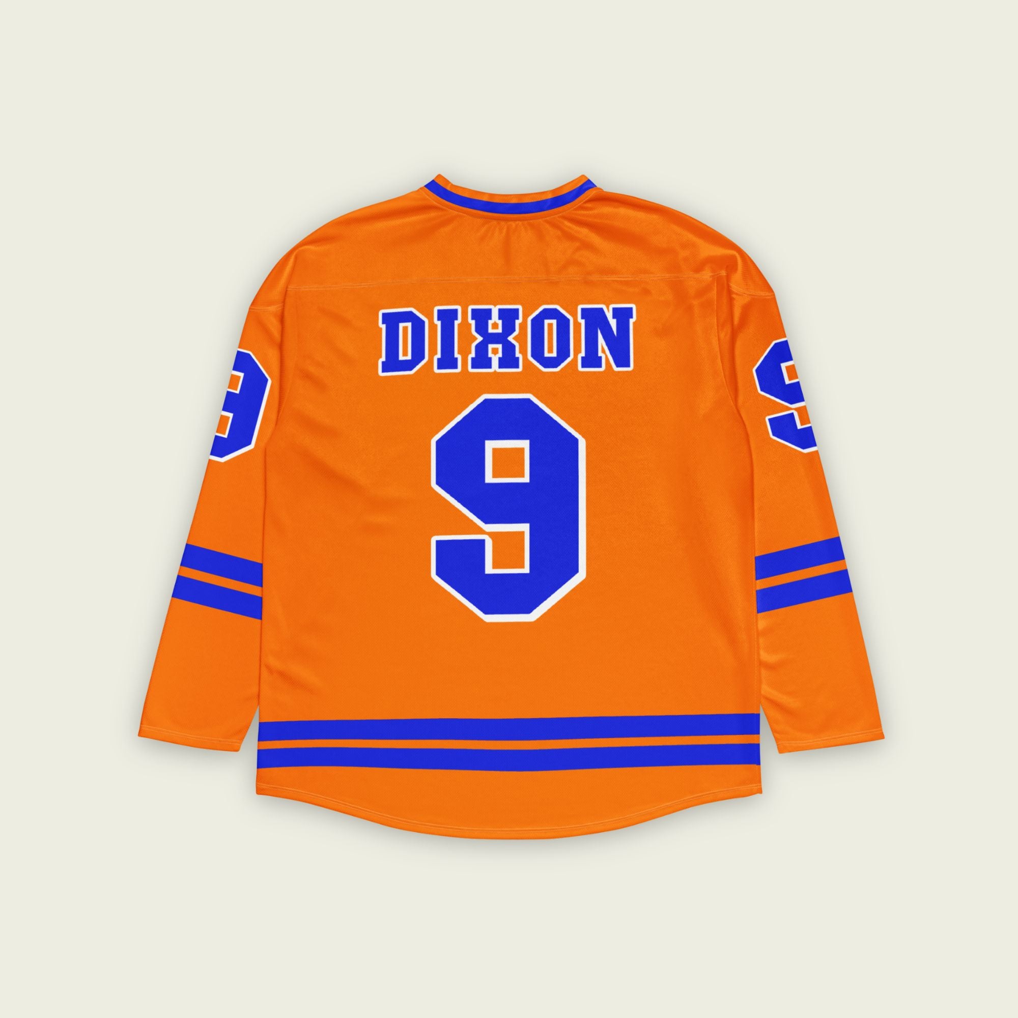 A orange hockey jersey with two blue lines at the bottom and on the arms. It has the number 9 for Scott dixon's race number in blue with a white outline. It also has the name Dixon on the front and back