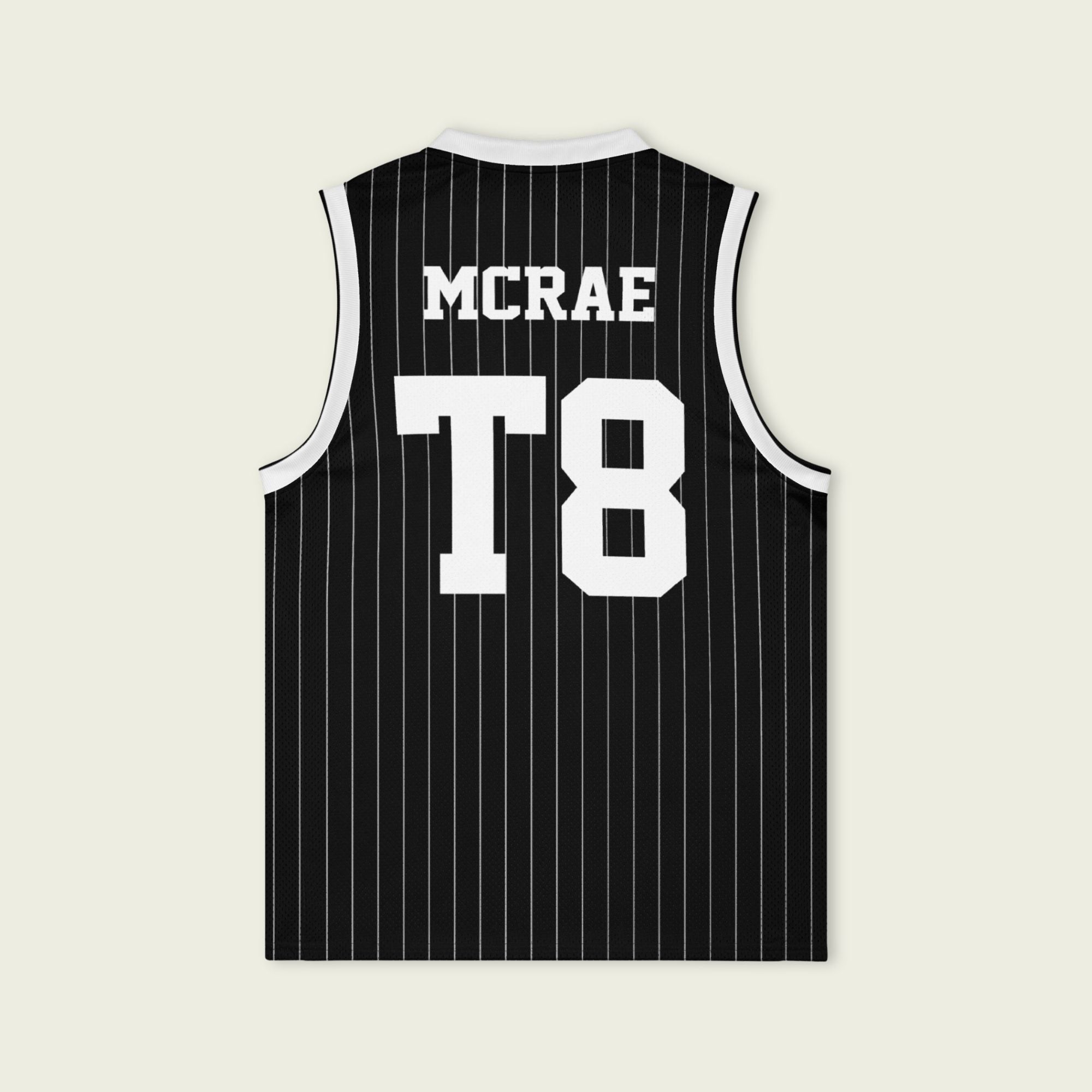 A black and white pin striped basketball Jersey with T8 Tate Mcrae on the front and back in white.