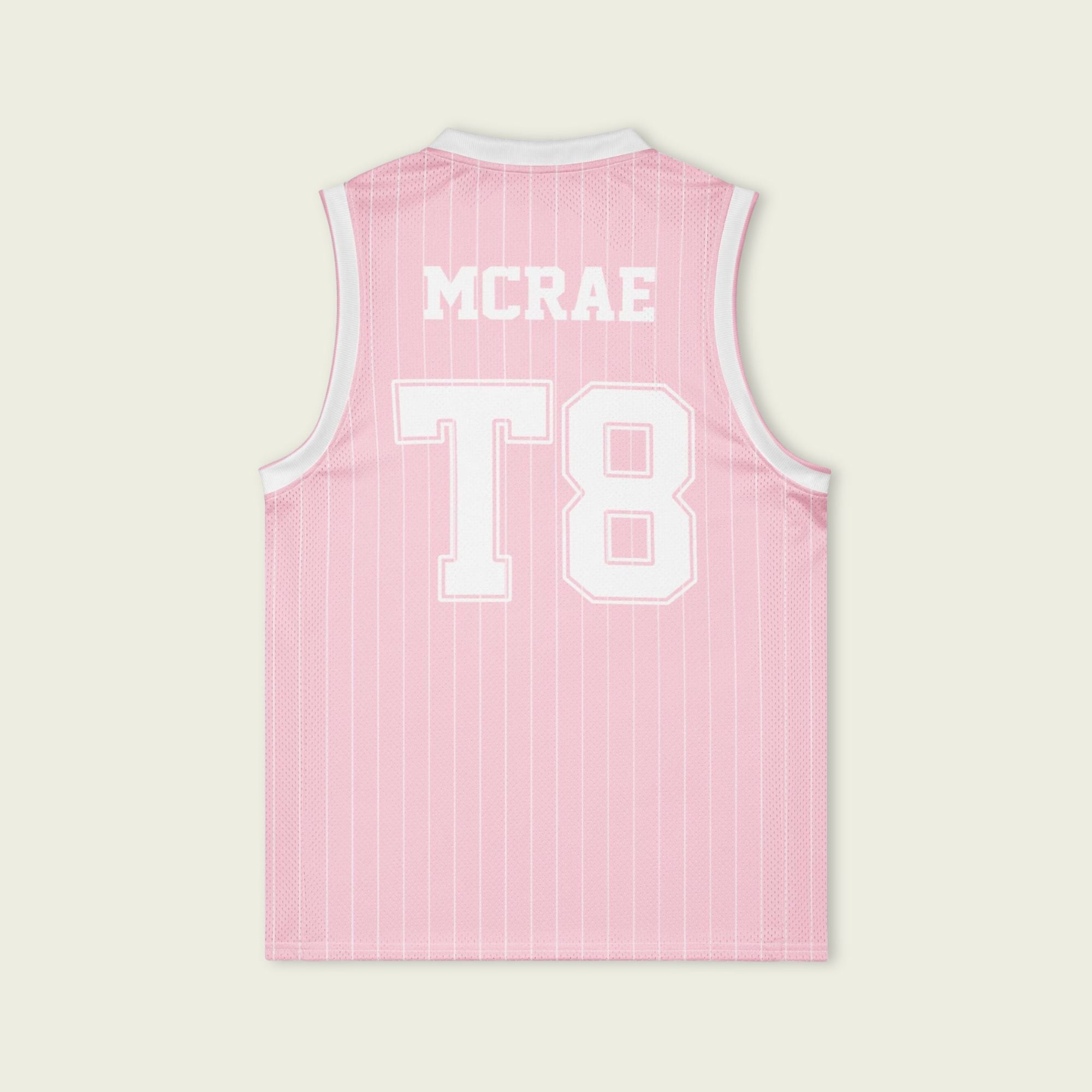 A pink and white pin striped basketball Jersey with T8 Tate Mcrae on the front and pink and white.