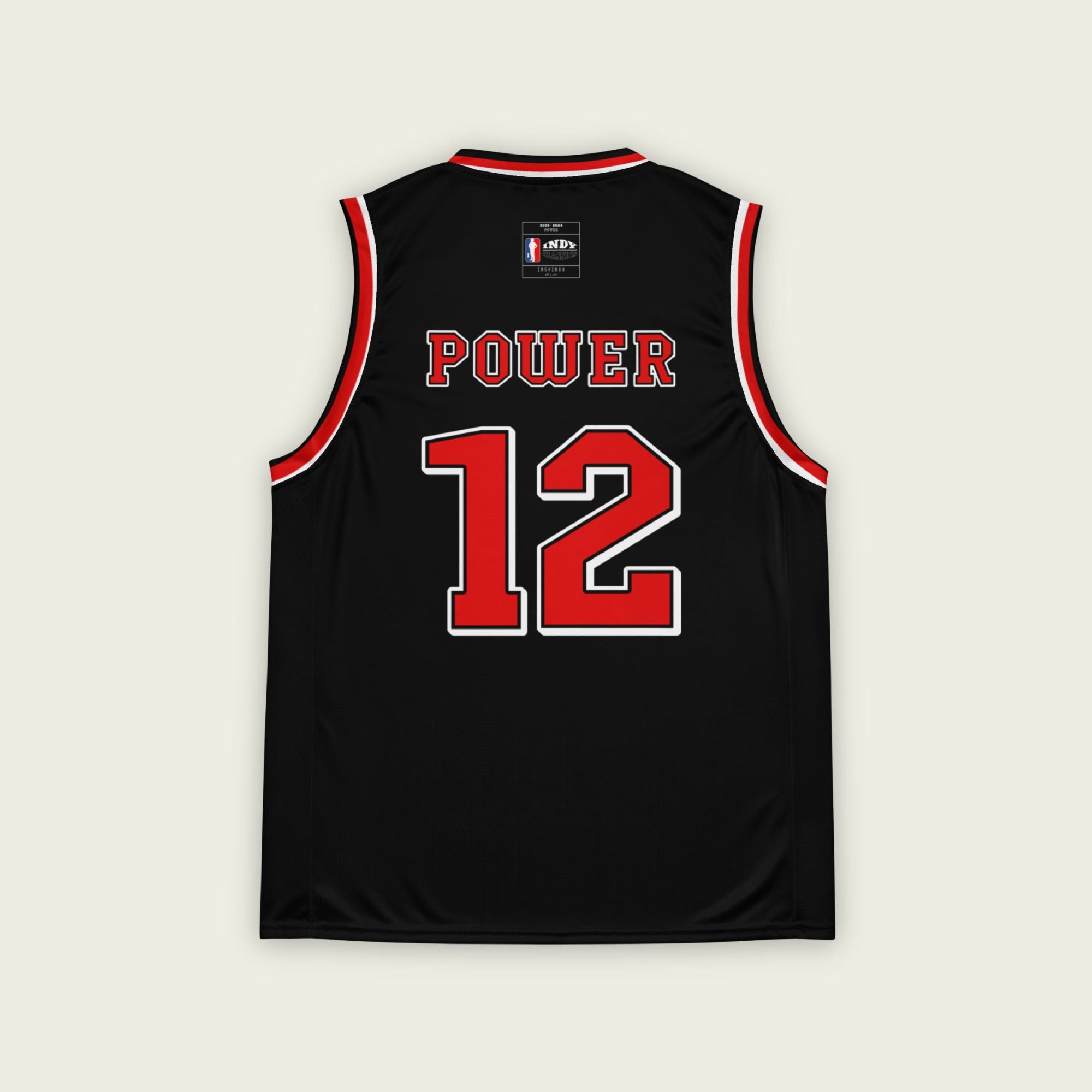 A black and red basketball singlet with Will Power's indycar racing number 12 in red on the front nd back.