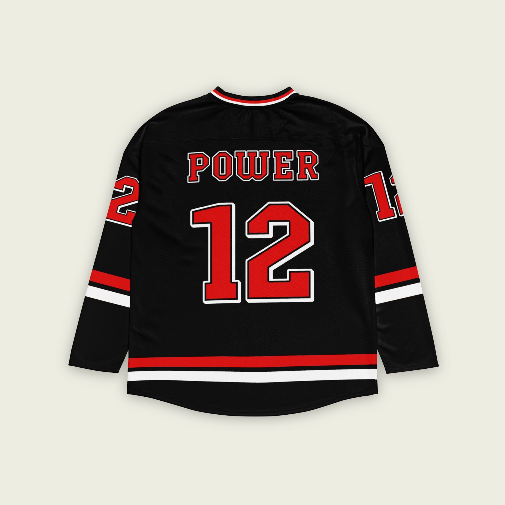 A black hockey jersey with Will Power's indycar racing number 12 on the front and back in red, also the name Power is on the back and front in red.