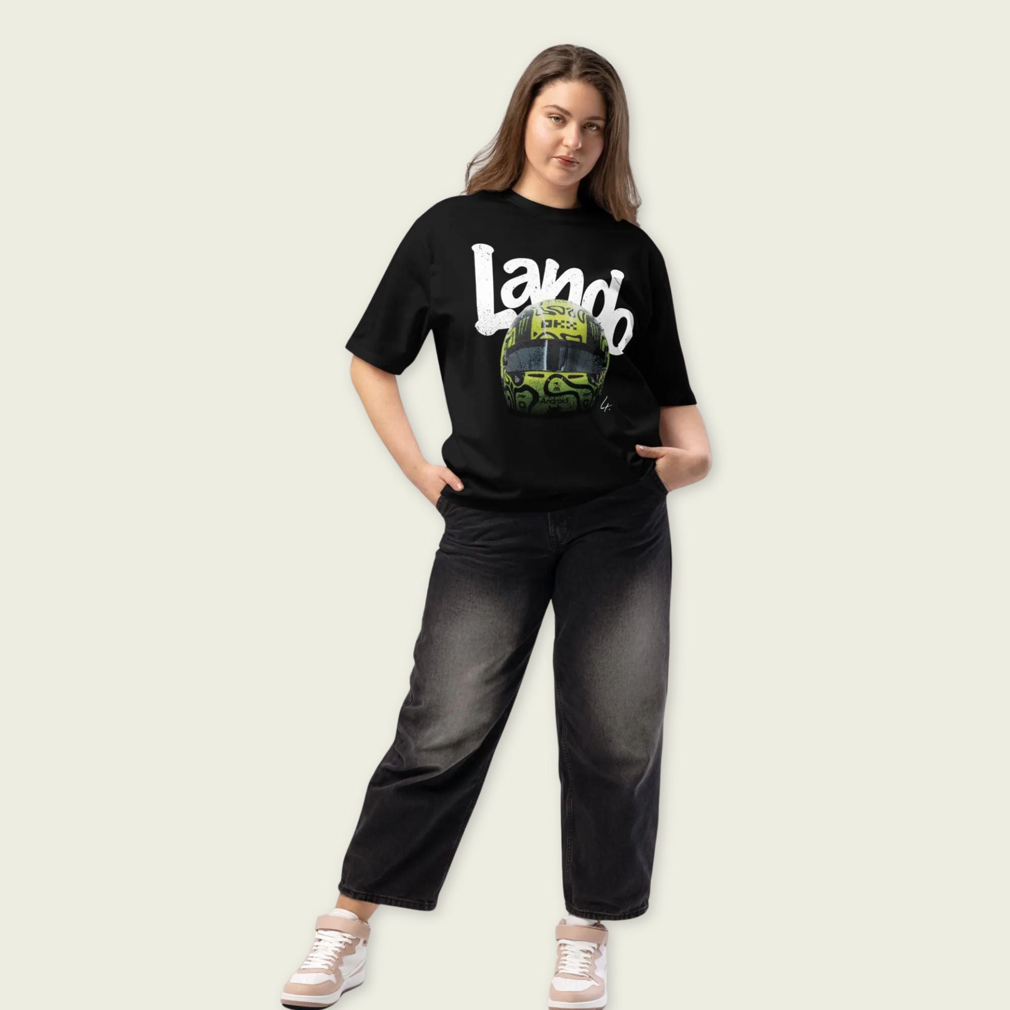 A black oversized TShirt with white text Lando on the front  and lando norris's neon green helmut on the front.
