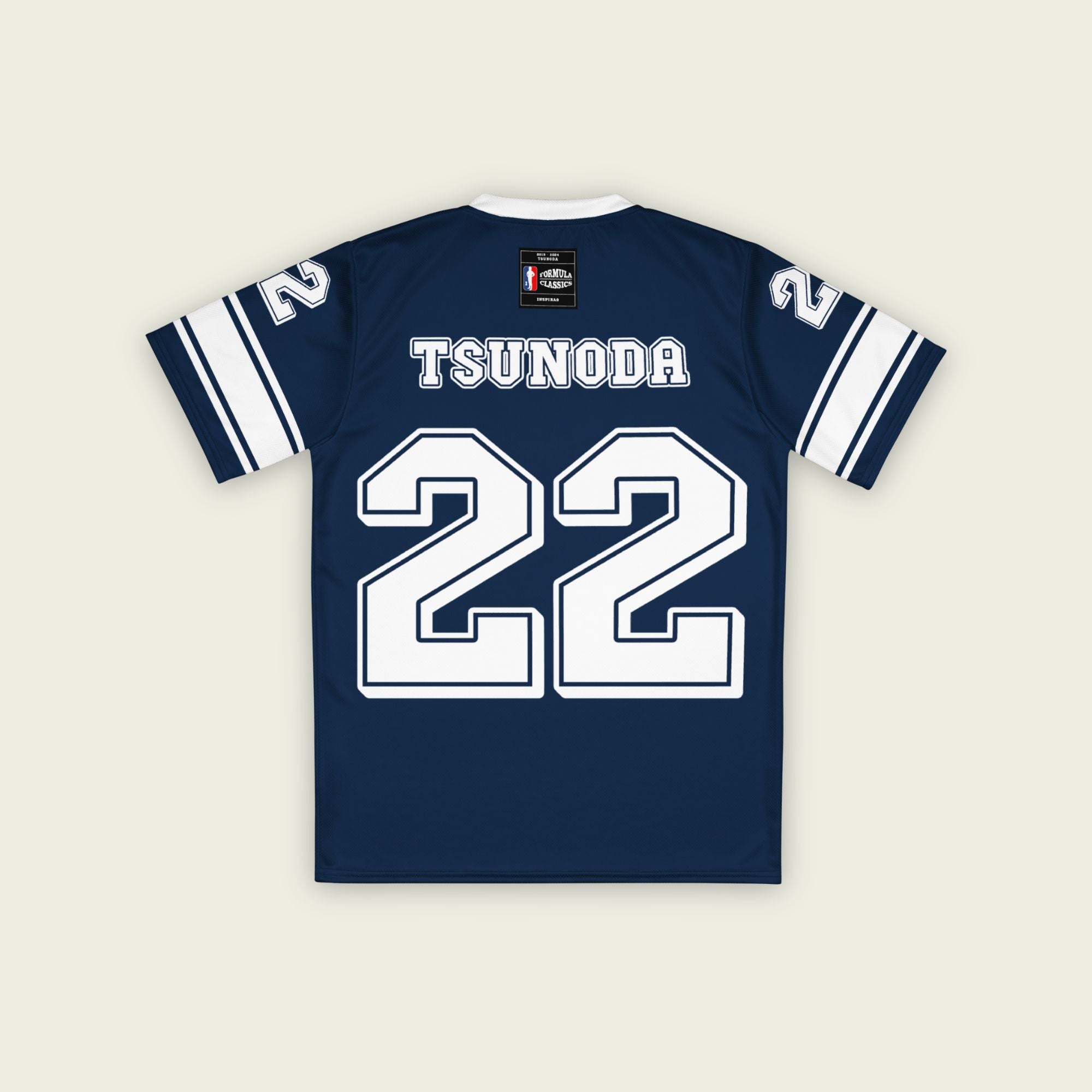 A navy blue and white football jersey it has Yuki Tsunoda's VCARB f1 racing number 22 on the front and back in white.