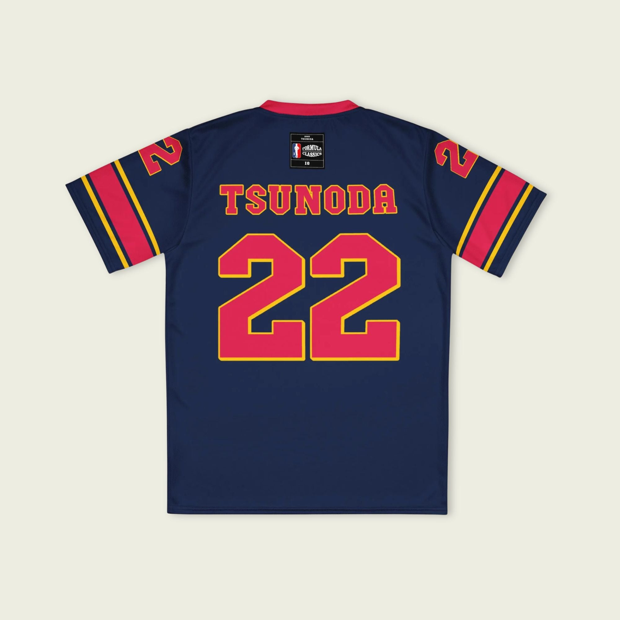 A navy blue and red football jersey with Yuki Tsunoda's Redbull F1 Racing number 22 on the front and back.
