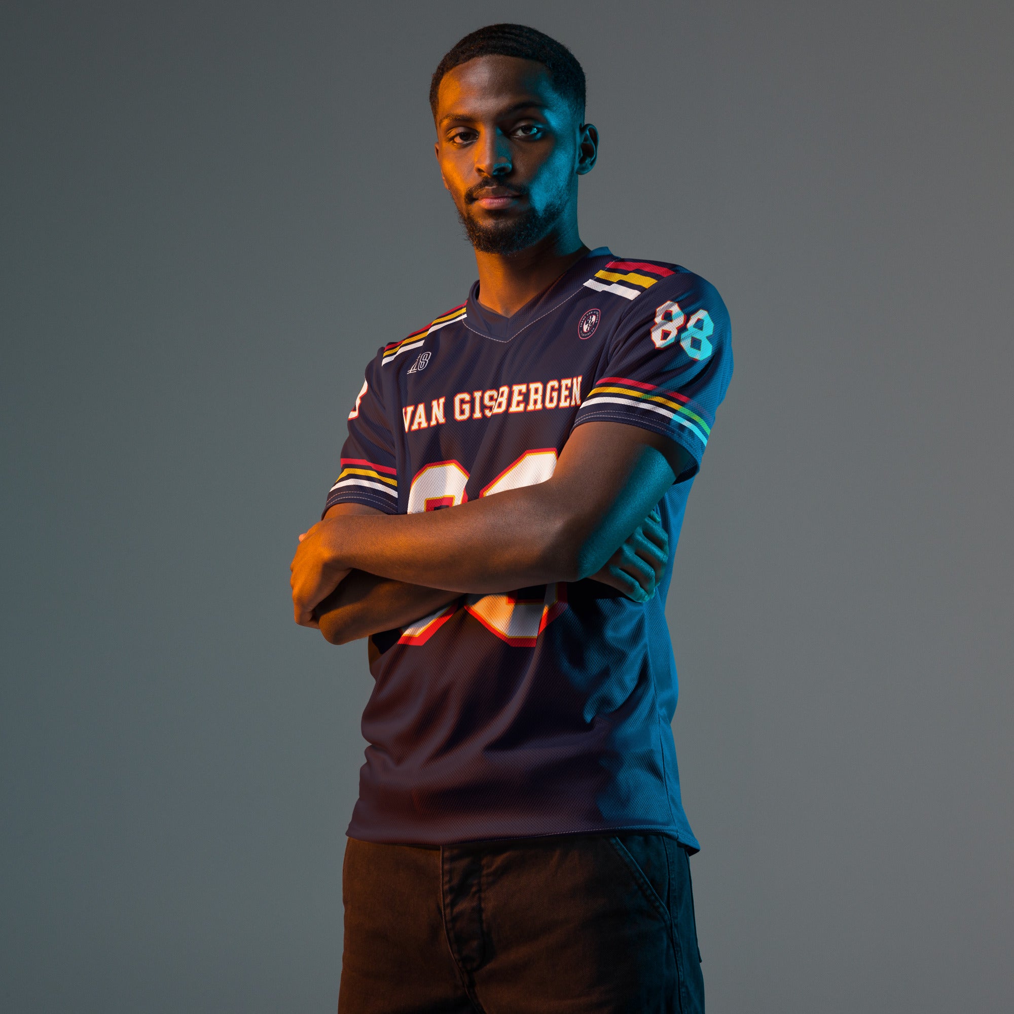 Man wearing a sports jersey with visible branding on a gray background
