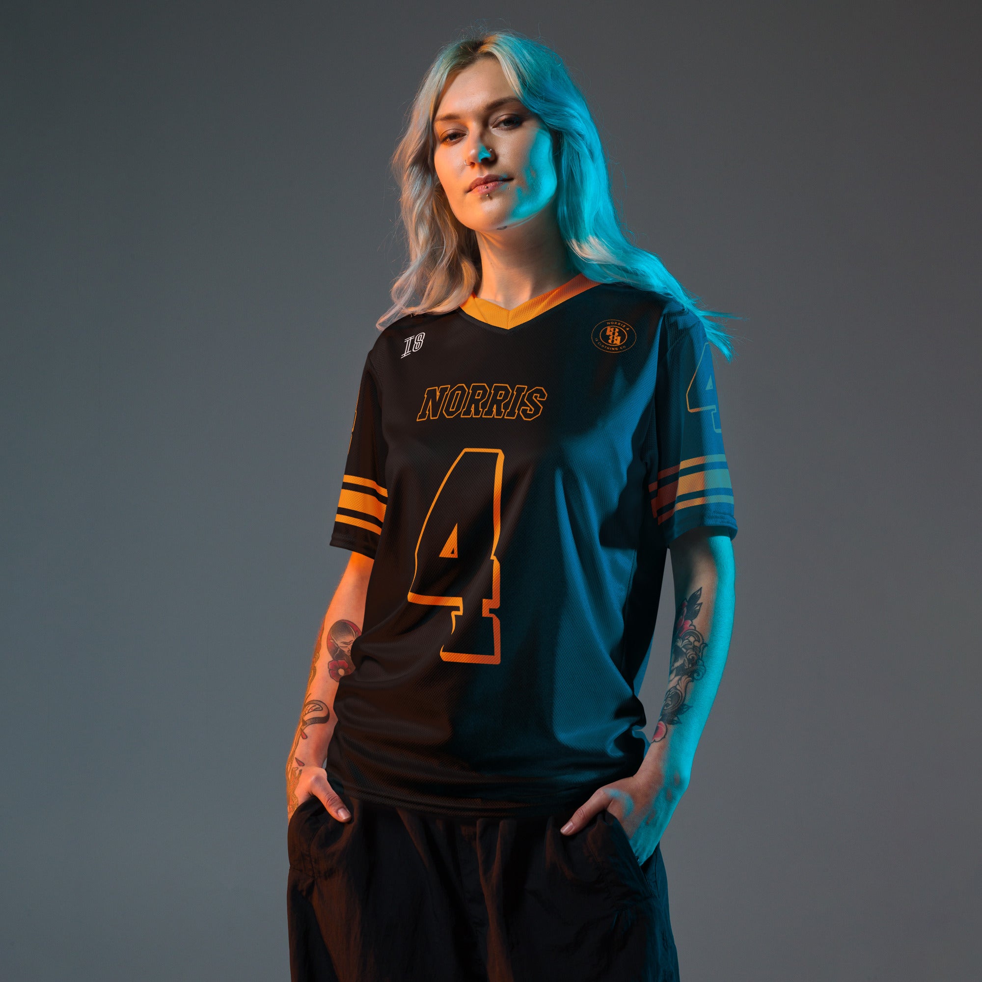 Person wearing a sports jersey with 'Norris' and number '4' on a gray background