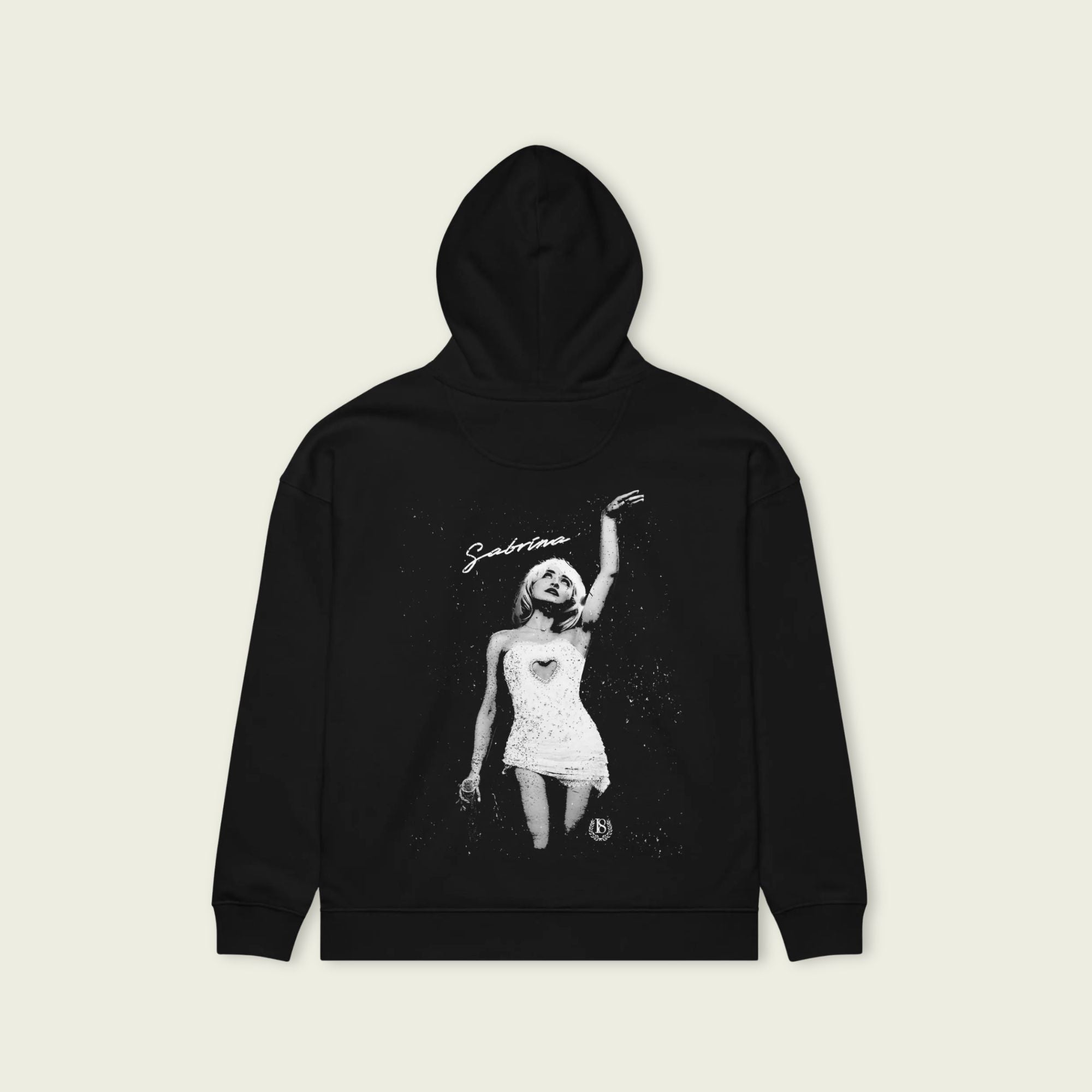 Black hoodie with a graphic design on a beige background