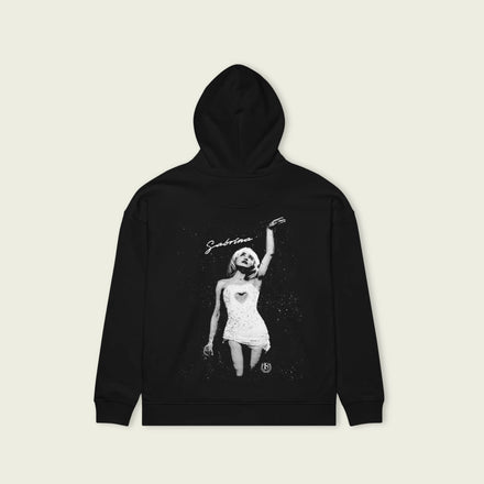 Black hoodie with a graphic design on a beige background
