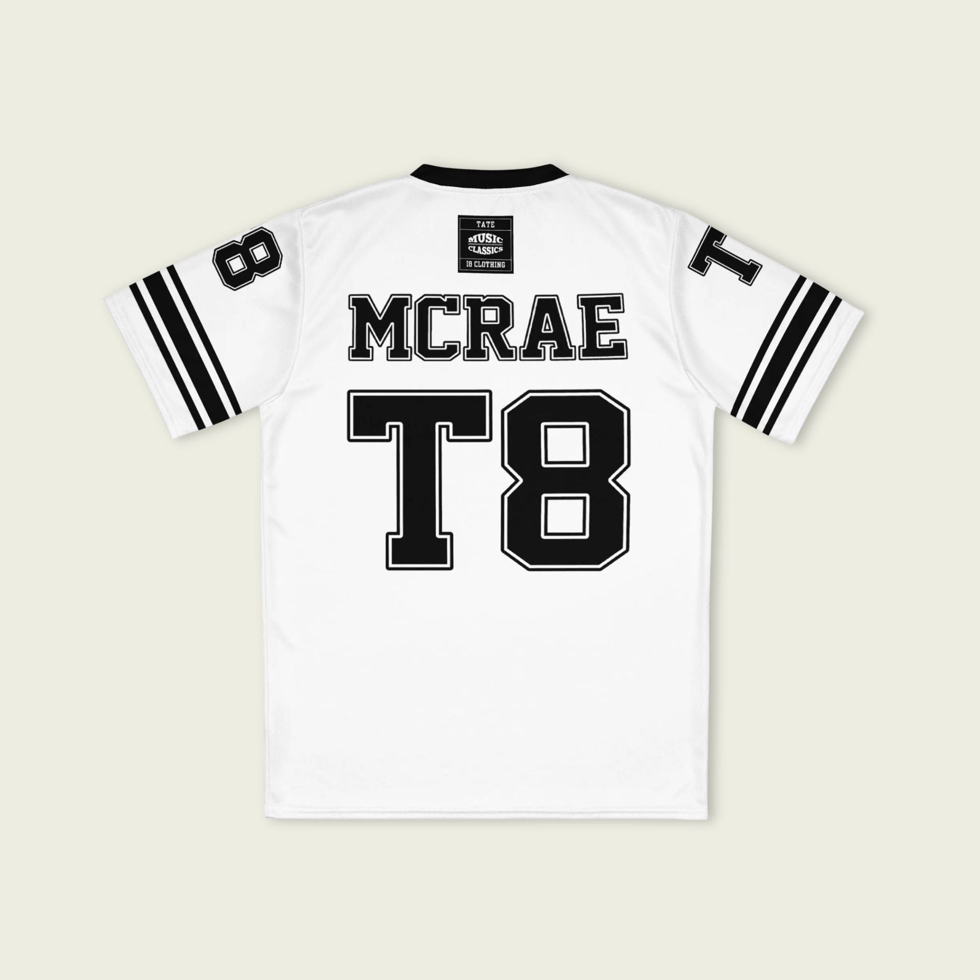 White sports jersey with black text and accents on a beige background