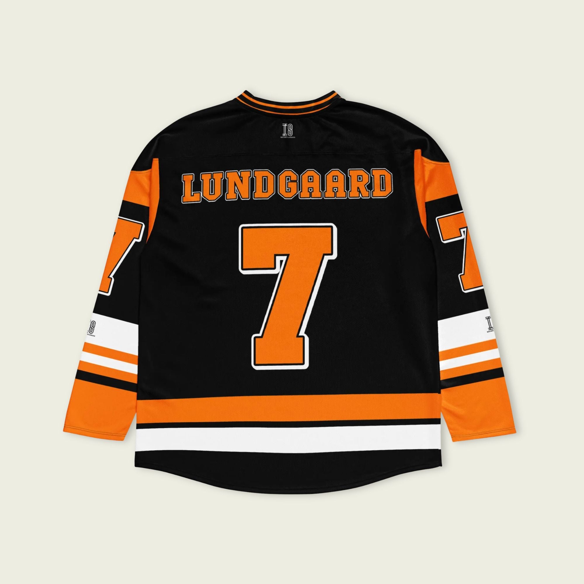 A black hockey jersey with christian lundgaard's name and indycar racing number 7 on the front and back in orange.