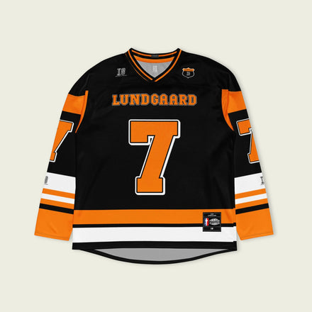 A black hockey jersey with christian lundgaard's name and indycar racing number 7 on the front and back in orange.