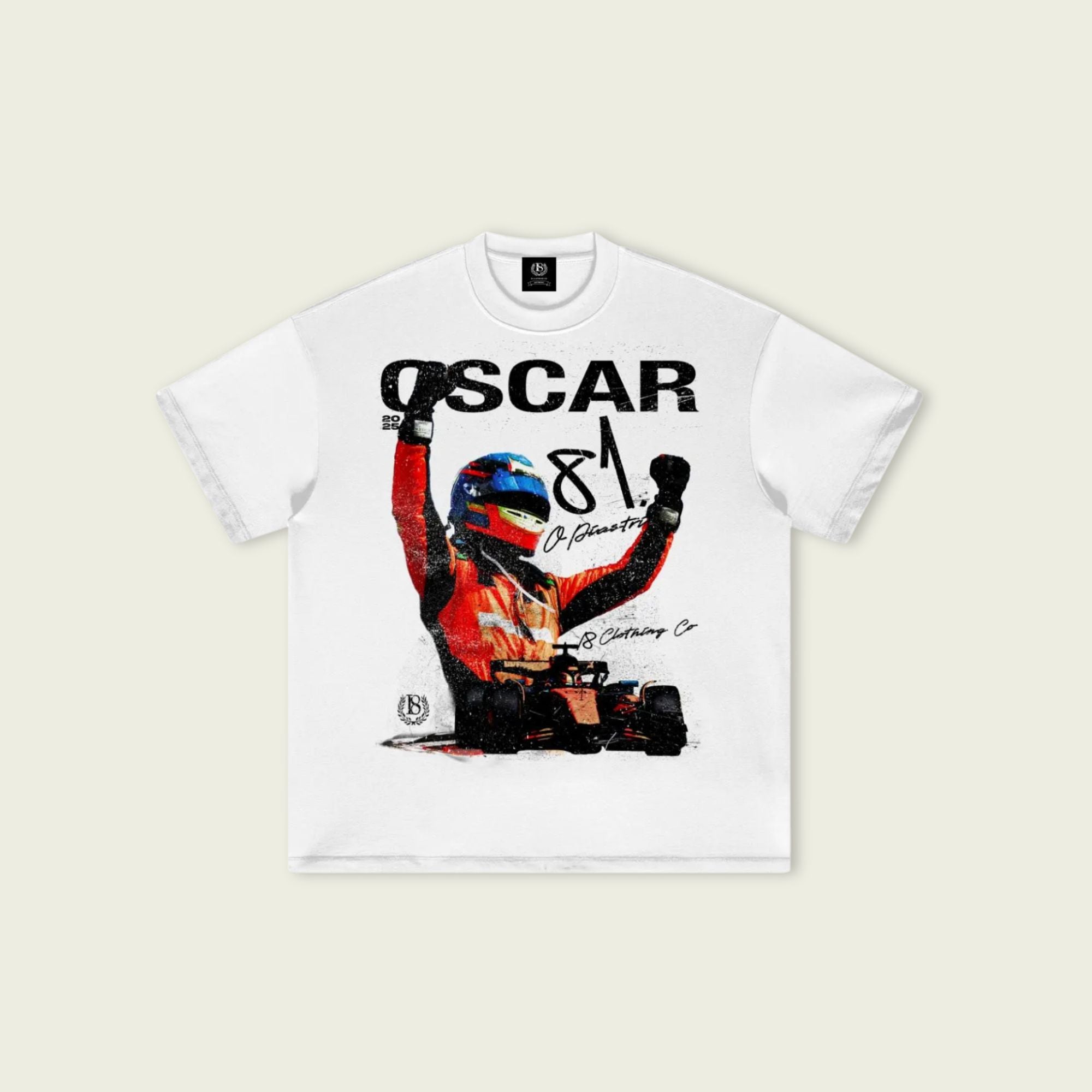 White t-shirt with a graphic of a driver and 'OSCAR 81' text on a beige background
