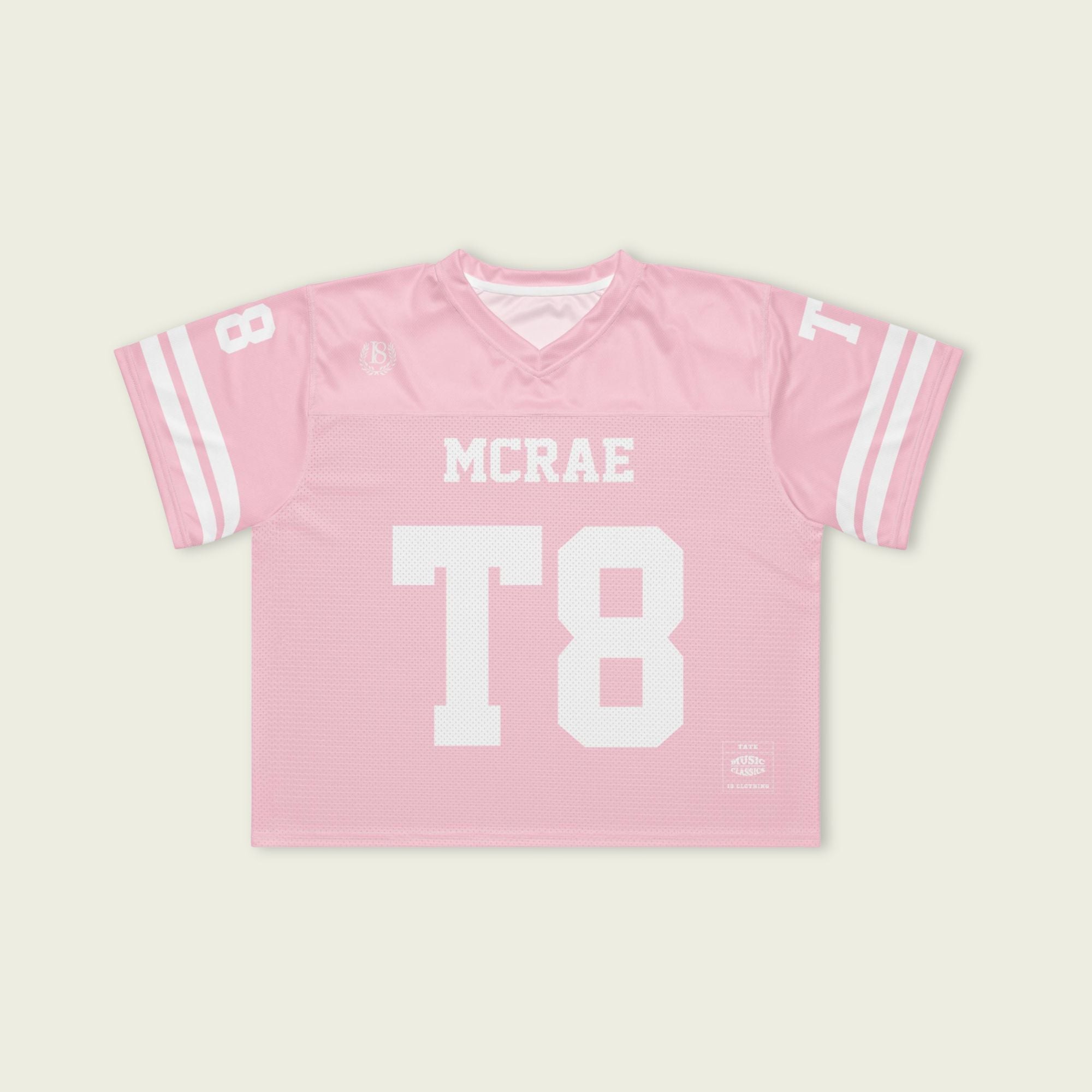 Pink sports jersey with 'MCRAE' and 'T8' printed on a light beige background