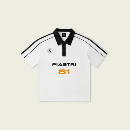 White polo shirt with black accents and 'PIASTRI' branding on a light beige background