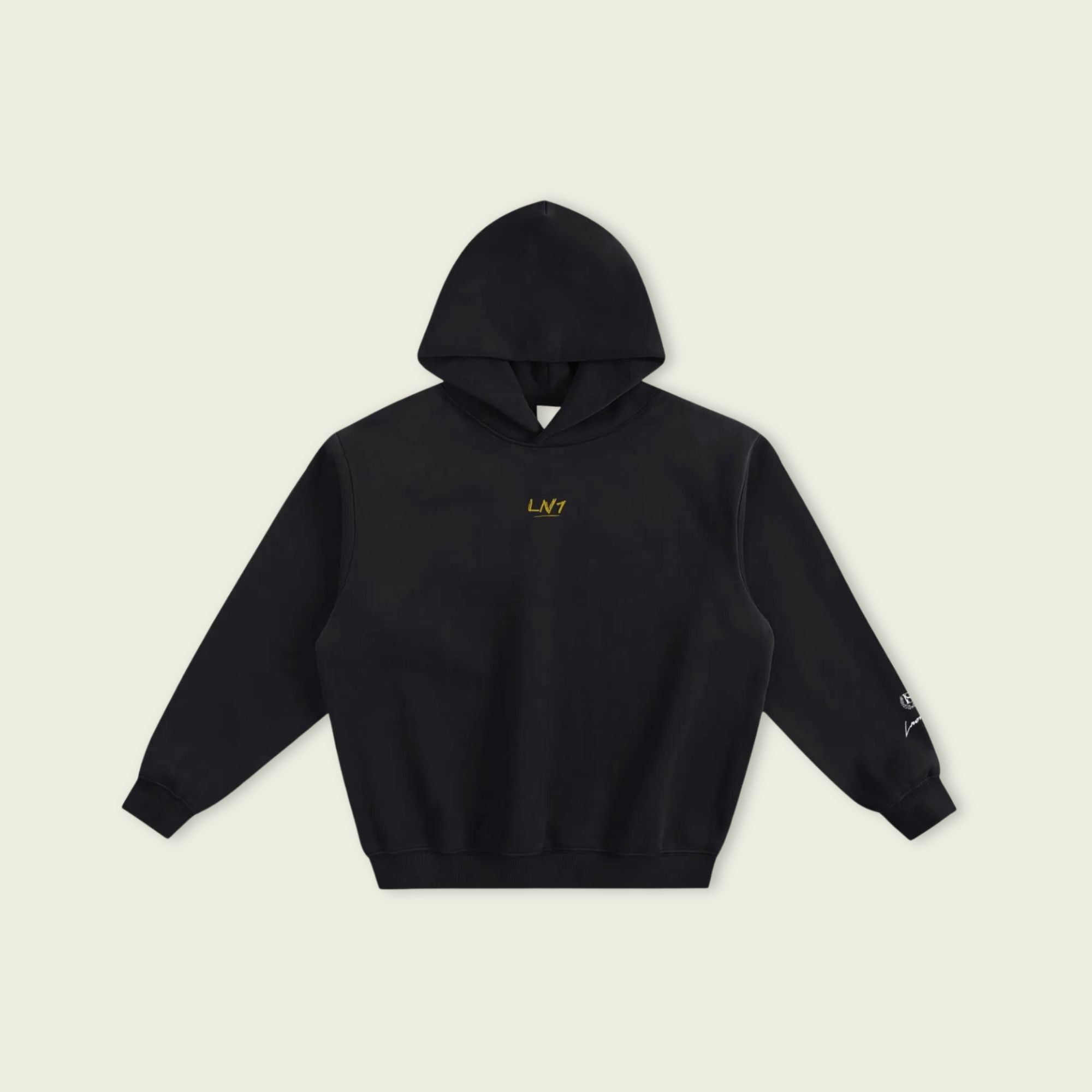 Black hoodie with a yellow logo on a beige background