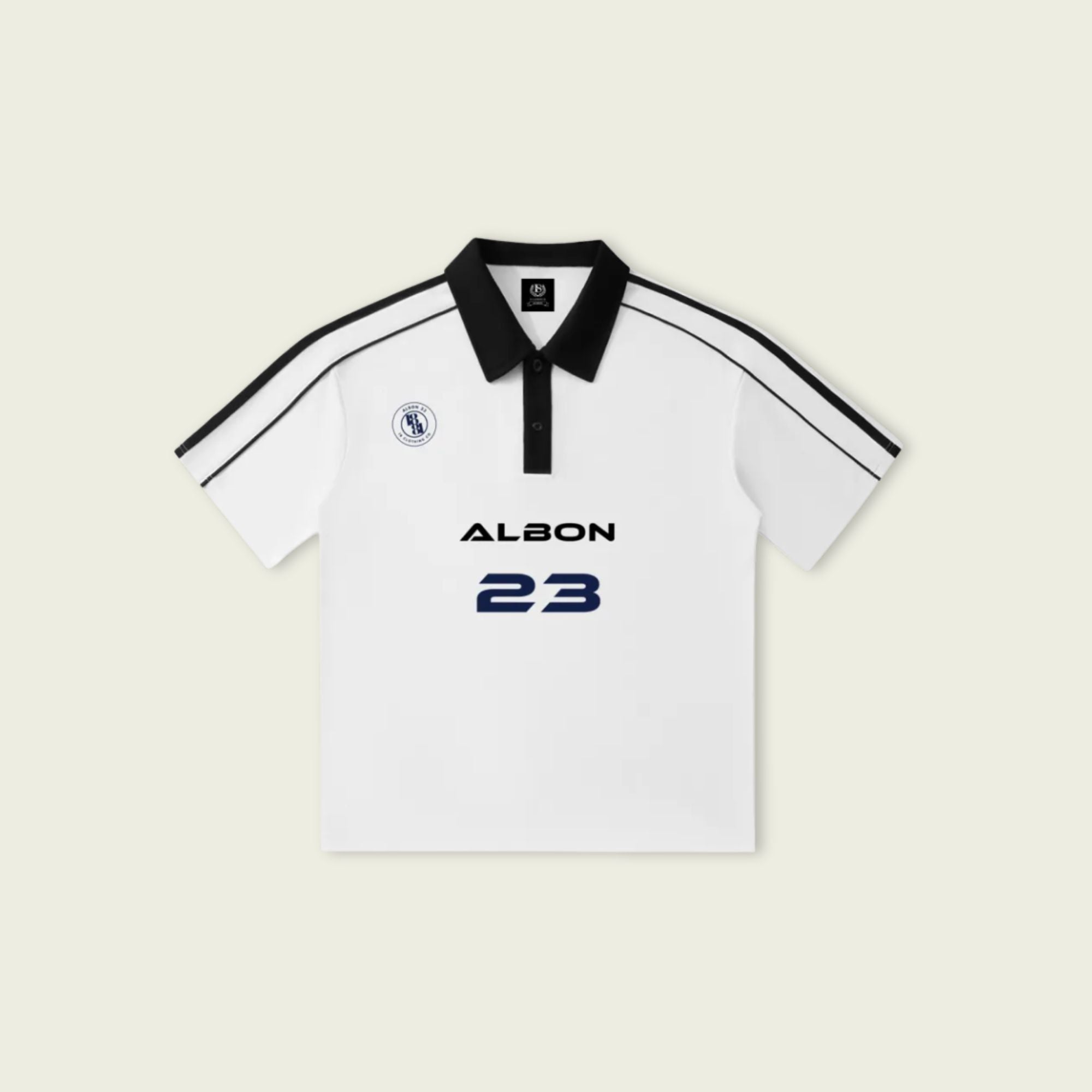 White polo shirt with black accents and 'Albon 23' branding on a light beige background
