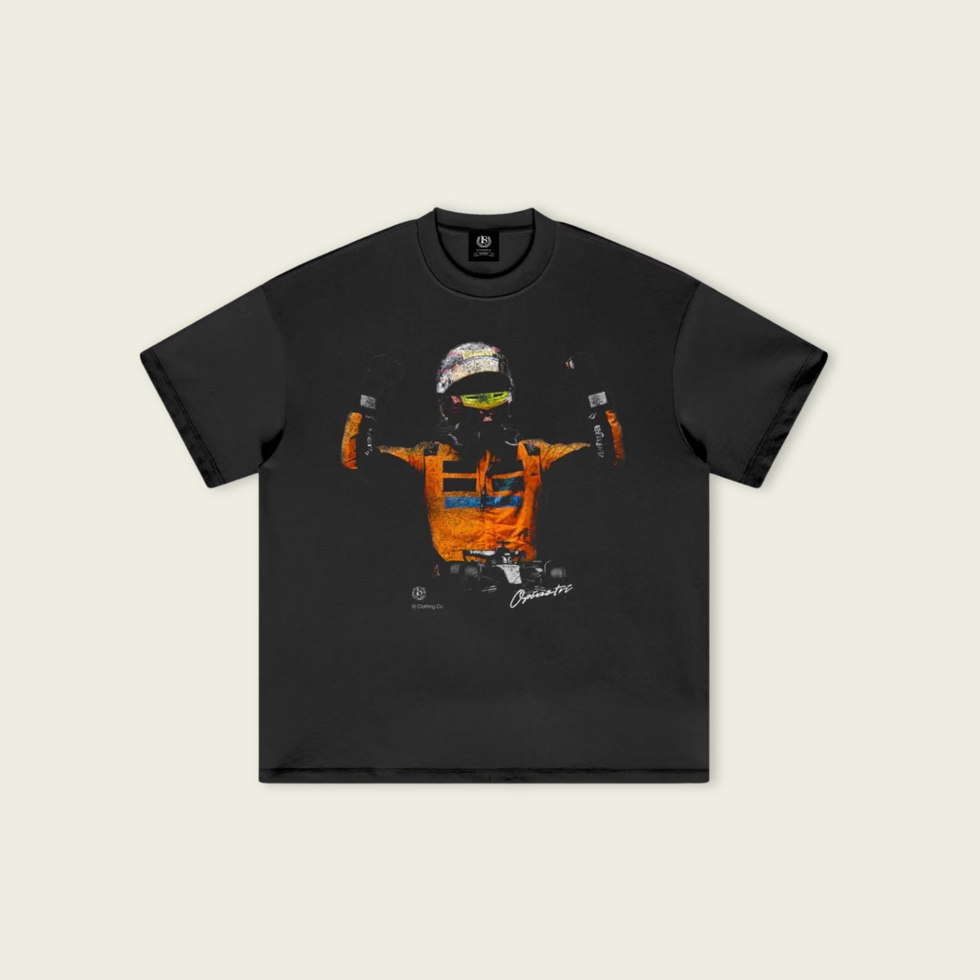 Black t-shirt with a colorful graphic design on a beige background