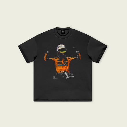 Black t-shirt with a colorful graphic design on a beige background