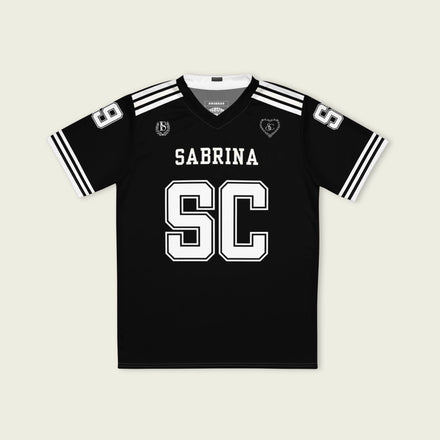 Black sports jersey with 'Sabrina SC' printed on a beige background