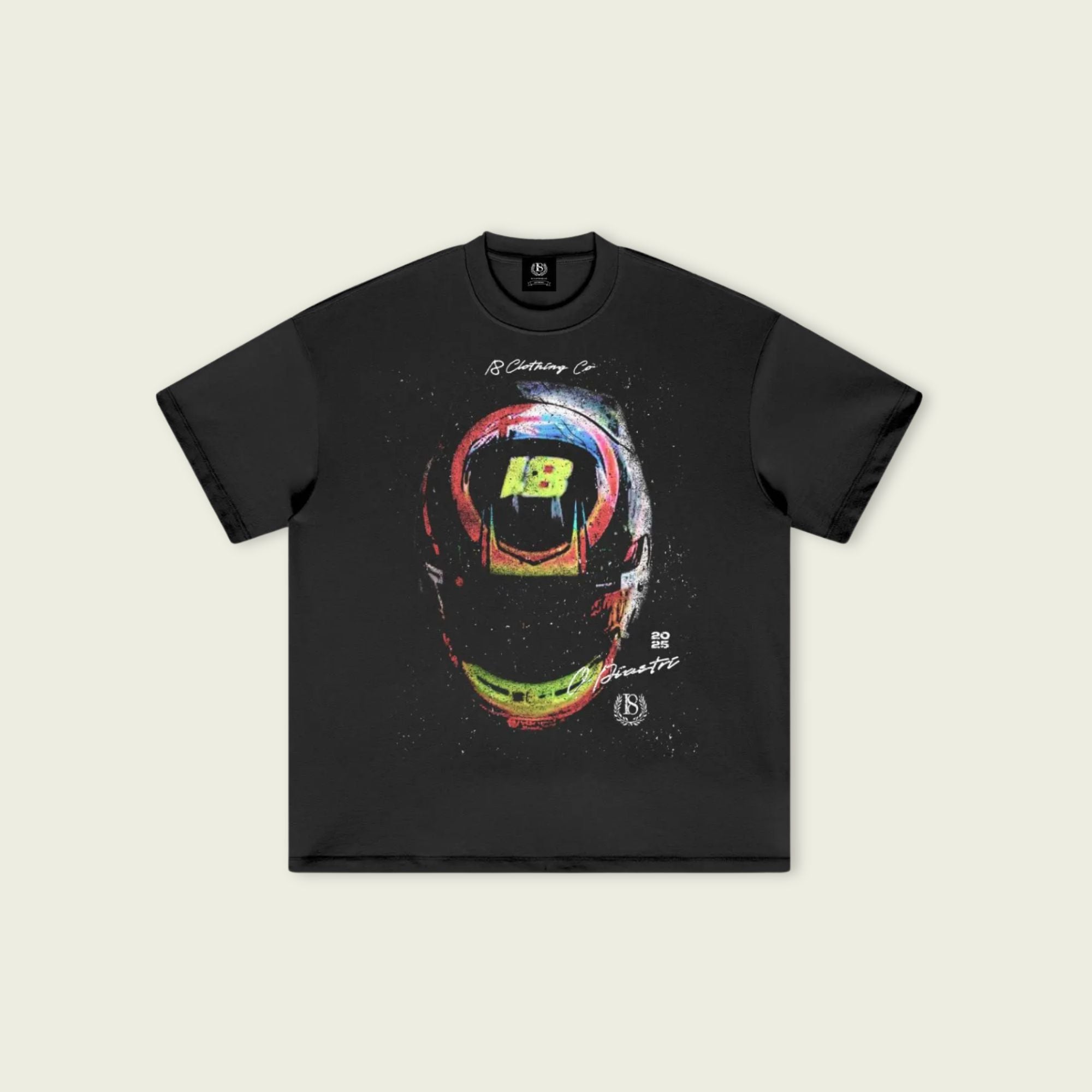 Black t-shirt with colorful helmet graphic on a beige background