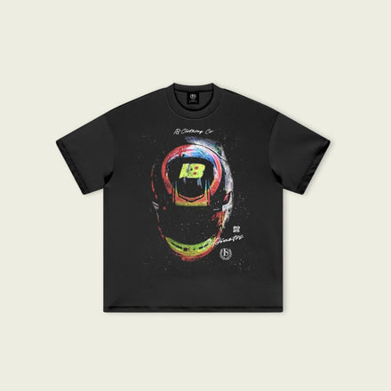 Black t-shirt with colorful helmet graphic on a beige background