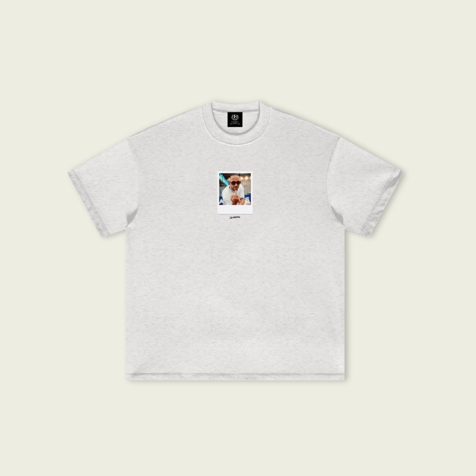 Gray t-shirt with a small graphic on a beige background