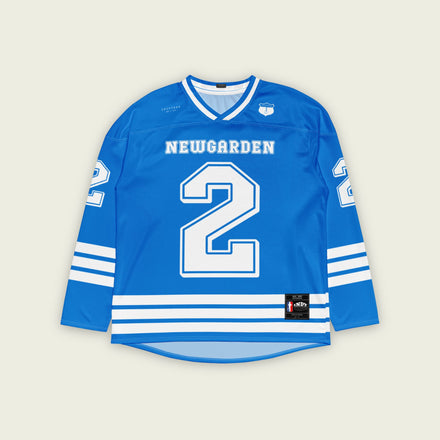 A blue hockey jersey with white and stripes. It has Newgarden's indycar racing number 2 and the name newgarden on the front and back in white.