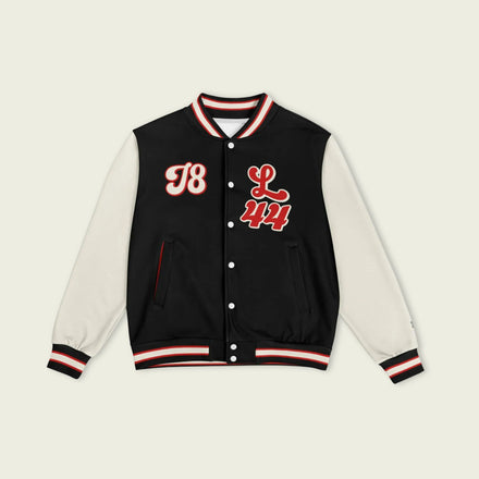 A black, red, and tan, varsity jacket with Lewis Hamilton's Ferrari F1 racing number 44 in red on the front and back.