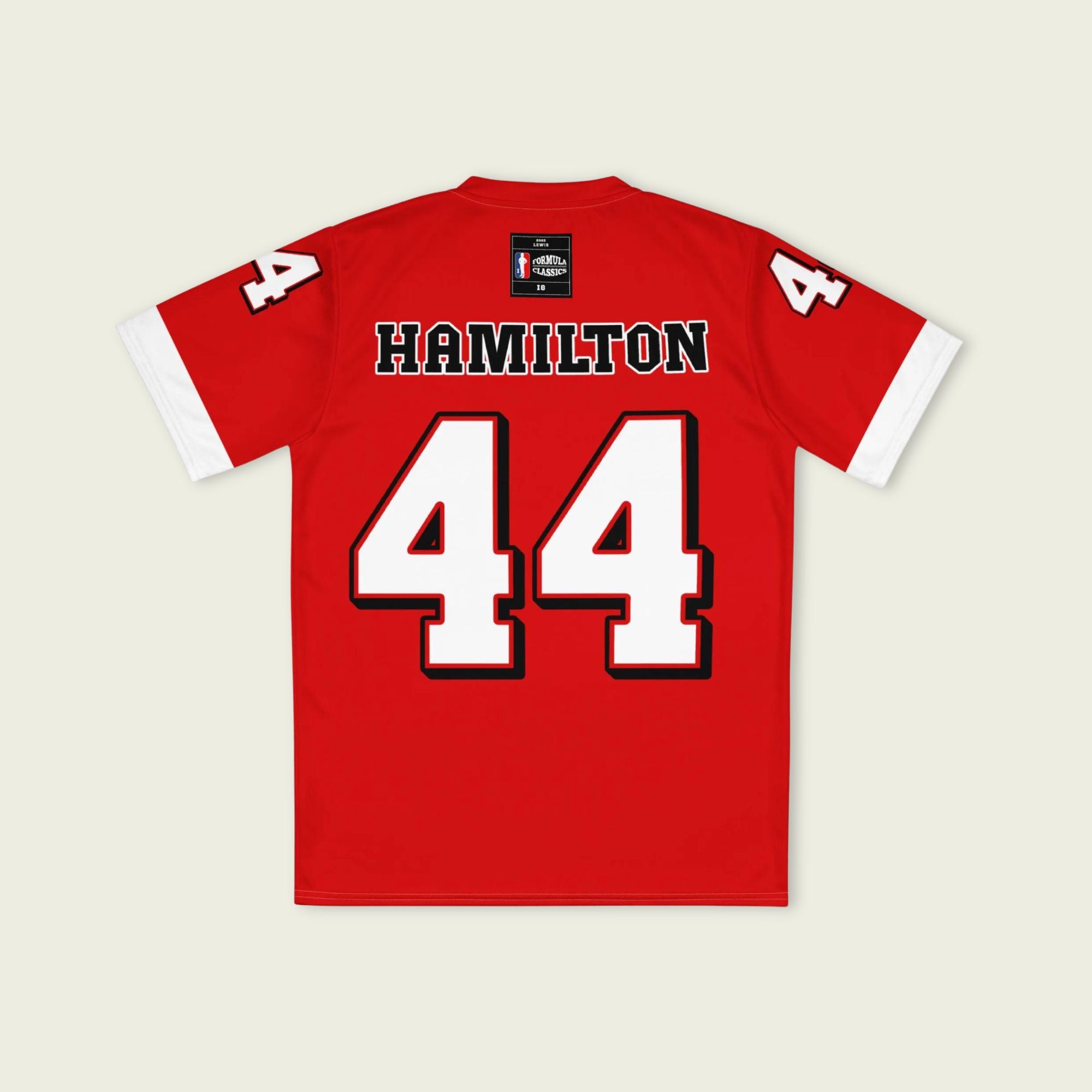A red and white football jersey with Lewis Hamilton's Ferrari  F1 racing number 44 on the back and front in white. It has the name Hamilton in red on the front and back as well.