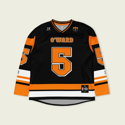 A black hockey jersey with Pato O'Ward's name and indycar racing number 5 on the front and back in orange.