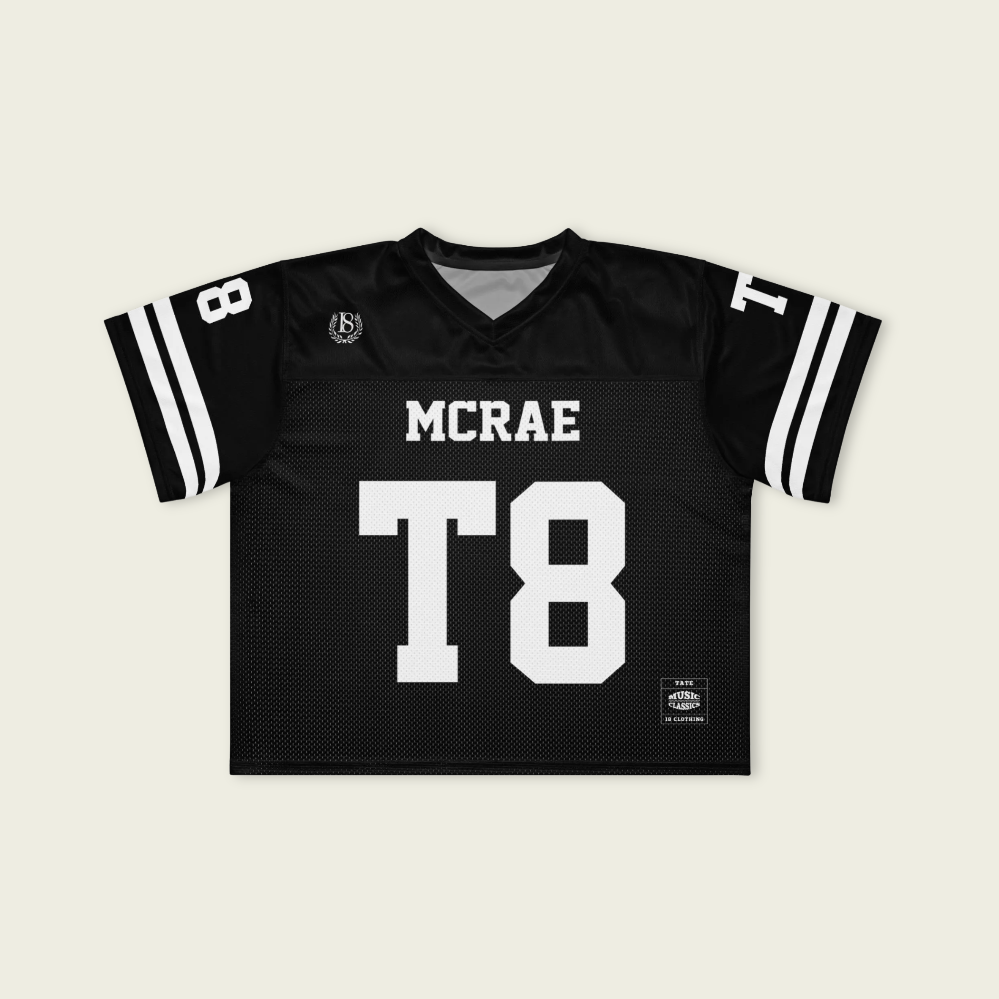 Black sports jersey with 'MCRAE' and 'T8' printed on a beige background